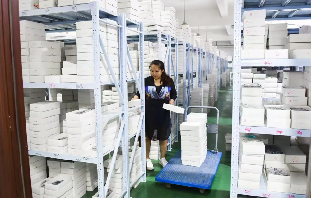 Organized shelving and trays for frame storage and handling.